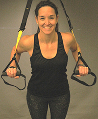 CGC fitness instructor Meaghan, holding TRX bands