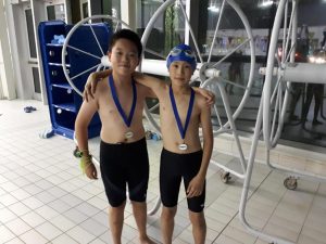 Daniel and Enoch with their medals