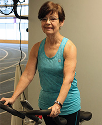 female fitness instructor on spin bike