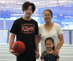 mom, son with basketball and daughter on the Track