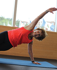 female fitness instructor in Pilates position